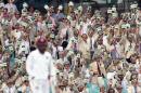 Hundred of spectators dressed as the late cricket commentator Richie Benaud watch Australia and the West Indies battle it out in Sydney on January 4, 2016
