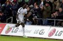 Swansea City's French striker Bafetimbi Gomis (L) celebrates a goal during the English Premier League football match between Swansea City and West Ham United in Swansea, south Wales on January 10, 2015
