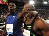 FILE - The May 26, 2011 file photo shows Jamaica's Asafa Powell, right, celebrating with his fellow-countryman Usain Bolt following the men's 100 meters event at the Golden Gala athletics meeting, in Rome. On Thursday, Aug 25, 2011 Asafa Powell has been ruled out of the 100 meters at the world championships because of a groin injury, eliminating defending champion Usain Bolt's biggest rival from the marquee event. (AP Photo/Andrew Medichini)