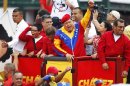 Venezuela's President Chavez acknowledges supporters before the registration of his presidential bid in Caracas