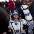 Ground personnel help member of the ISS crew U.S. astronaut Michael Fossum to get out off the Soyuz capsule minutes after landing near the town of Arkalyk, northern Kazakhstan,Tuesday, Nov. 22, 2011.  (AP Photo/Sergei Remizov, Pool)