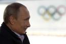 Russia's President Vladimir Putin looks on during his interview with journalists in Sochi, on January 19, 2014