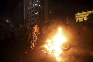 Protesters set a motorbike on fire during a protest&nbsp;&hellip;