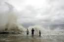 People watch a wave from Hurricane Dennis in 2005 near Orange Beach, Alabama