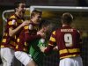 Bradford City's players celebrate after winning a penalty shootout against Arsenal during their English League Cup soccer match in Bradford