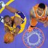 Los Angeles Lakers guard Kobe Bryant, left, shoots as Phoenix Suns forward Markieff Morris defends during the first half of their NBA basketball game, Friday, Feb. 17, 2012, in Los Angeles. (AP Photo/Mark J. Terrill)