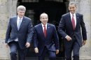 FILE - In this Aug. 10, 2009, file photo, President Barack Obama, right, Mexico's President Felipe Calderon, center, and Canada's Prime Minister Stephen Harper walk towards a stand for an official photo in Guadalajara, Mexico, for a North American summit. Obama is convening a summit with leaders from Mexico and Canada on Monday, April 2, 2012, that aims to boost a fragile recovery and grapple with thorny energy issues against a backdrop of painfully high gas prices. The session at the White House is a make-good for a planned meeting last November in Hawaii on the sidelines of the Asia-Pacific summit. Obama ended up meeting just with Harper when Mexican President Felipe Calderon's top deputy was killed in a helicopter crash. (AP Photo/Alex Brandon, File)