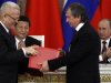 Russia's President Vladimir Putin and his Chinese counterpart Xi Jinping attend a signing ceremony at the Kremlin in Moscow