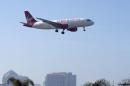 A Virgin America plane is shown on final approach to land in San Diego, California