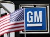 The U.S. flag flies at the Burt GM auto dealer in Denver