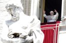 Pope Benedict XVI delivers his blessing during the Angelus prayer from his studio overlooking St. Peter's square at the Vatican, Sunday, June 17, 2012. (AP Photo/Riccardo De Luca)