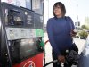Rosahn Buchanan fills her tank with gas at a station in Arcadia, Calif., Tuesday, March 20,  2012. From all corners of the country, Americans are poorer and angrier these days, thanks to the record fuel prices that have soared above $4 a gallon in some states and could top $5 by summer.(AP Photo/Nick Ut)