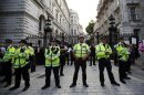 Police guard the entrance to Downing Street during a rally against the proposed attack on Syria in central London