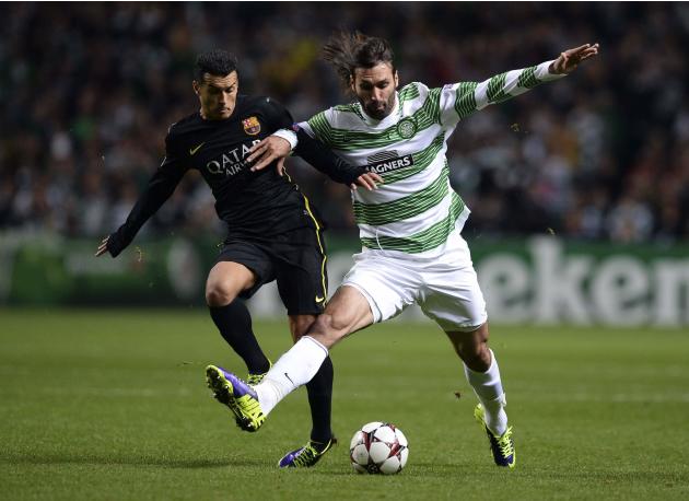 Celtic's Samaras challenges Barcelona's Pedro during their Champions League soccer match at Celtic Park in Glasgow