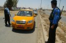 Iraqi police man a checkpoint in Kirkuk