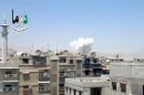In this image taken from video obtained from the Shaam News Network, which has been authenticated based on its contents and other AP reporting, columns of smoke billow above houses as a result of heavy bombing in Damascus, Syria, Monday July 22, 2013. Syrian rebels seized a strategic village on the edge of the northern city of Aleppo on Monday, activists said, just hours after other opposition fighters sustained some of their heaviest losses in months in battles to the south near the capital, Damascus. Logo: reads, "Douma Network – Free People of Douma." (AP Photo/Shaam News Network via AP video)