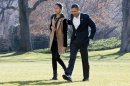 President Barack Obama walks with daughter Malia on the first family's return from vacationing in Hawaii, on the South Lawn of the White House in Washington, Sunday, Jan. 6, 2013. (AP Photo/Jacquelyn Martin)