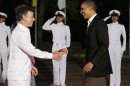 President Barack Obama, right, shakes hands with Colombia's President Juan Manuel Santos during a dinner at the sixth Summit of the Americas in Cartagena, Colombia, Saturday April 14, 2012. (AP Photo/Fernando Llano)