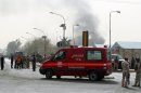 An ambulance arrives at the scene of a bomb attack in Baghdad, on March 14, 2013