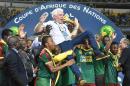Cameroon team players lift Cameroon's Belgian coach Hugo Broos as the celebrate after beating Egypt 2-1 to win the 2017 Africa Cup of Nations final football match between Egypt and Cameroon on February 5, 2017
