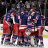 Members of the New York Rangers celebrate after defeating the Ottawa Senators 2-1 in Game 7 of a first-round NHL hockey Stanley Cup playoff series on Thursday, April 26, 2012, in New York. (AP Photo/Julio Cortez)