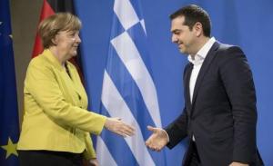 German Chancellor Merkel and Greek Prime Minister Tsipras go to shake hands after addressing news conference in Berlin