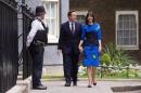 Britain's Prime Minister David Cameron and his wife Samantha return to Number 10 Downing Street after meeting with Queen Elizabeth in London