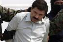 Joaquin "El Chapo" Guzman is escorted to a helicopter in handcuffs by Mexican navy marines at a navy hanger in Mexico City, Saturday, Feb. 22, 2014. A senior U.S. law enforcement official said Saturday, that Guzman, the head of Mexicoís Sinaloa Cartel, was captured alive overnight in the beach resort town of Mazatlan. Guzman faces multiple federal drug trafficking indictments in the U.S. and is on the Drug Enforcement Administrationís most-wanted list. (AP Photo/Eduardo Verdugo)