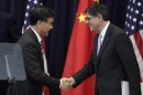 U.S. Treasury Secretary Lew shakes hands with Chinese Vice Premier Wang in Washington