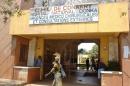 People walk in front of the Donka hospital in the Guinean capital Conakry on March 27, 2014