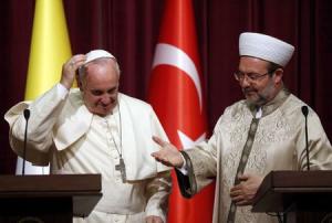 Pope Francis prepares to shake hands with Gormez, head &hellip;