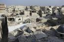 A general view of damage after what activists said was an air strike by forces loyal to Syria's President Bashar al-Assad in the Al-Maysar neighbourhood of Aleppo
