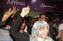 Nobel Peace Prize winner Tawakul Karman of Yemen gestures as she leaves Sanaa International Airport upon her arrival from Egypt