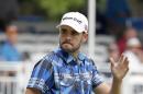 Troy Merritt waves to the crowd after making a birdie putt on 15th green during the second round of the RBC Heritage golf tournament in Hilton Head Island, S.C., Friday, April 17, 2015. (AP Photo/Stephen B. Morton)