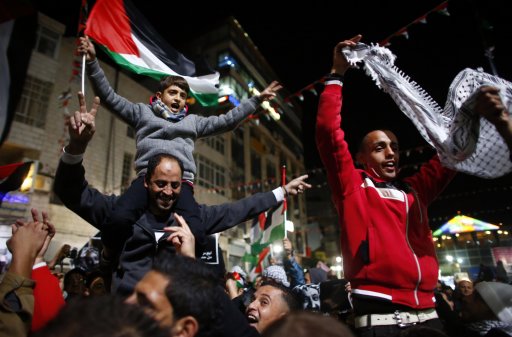 Palestinians shout slogans during a rally in the West Bank city of Ramallah