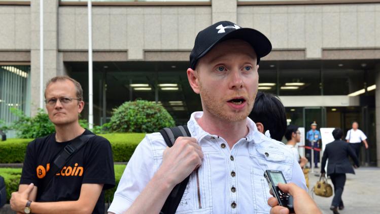 Bitcoin trader Kolin Burges from Britain speaks to a reporter after he attended the first creditors&#39; meeting of failed Bitcoin exchange MtGox in Tokyo on July 23, 2014