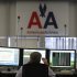 FILE - In this January 26, 2012, file photo, shows the flight control center at American Airlines headquarters in Fort Worth, Texas. Travelers stranded by Hurricane Sandy are seeing service slowly restored across the Northeast. But it'll be days before things are close to normal.  (AP Photo/LM Otero)