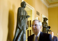 Senate Minority Leader Mitch McConnell, R-Ky., walks to the Senate floor on Capitol Hill in Washington on Wednesday, July 20, 2011.(AP Photo/Harry Hamburg)