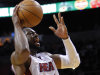Miami Heat's Dwyane Wade (3) goes to the basket against the Sacramento Kings in the first half of an NBA basketball game in Miami, Tuesday, Feb. 21, 2012. (AP Photo/Alan Diaz)