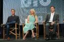 This image released by USA Network shows, from left, Co-Creator/Executive Producer Tim Kring, with actors Anne Heche, and Jason Isaacs participating in the "Dig" panel of the NBCUniversal Press Tour, July 2014 on Monday, July 14, 2014 in Beverly Hills, Calif. (AP Photo/USA Network, Chris Haston)