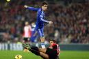 Chelsea's Oscar, top, vies for the ball with Sunderland's Jack Rodwell during their English Premier League soccer match at the Stadium of Light, Sunderland, England, Saturday, Nov. 29, 2014. (AP Photo/Scott Heppell)