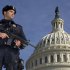 Capitol Police officer Angel Morales, stands on guard on the West side of the Capitol in Washington Friday, Feb. 17, 2012. A 29-year-old Moroccan man was arrested Friday in an FBI sting operation near the U.S. Capitol while planning to detonate what police say he thought were live explosives.   (AP Photo/Manuel Balce Ceneta)