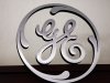 FILE-  This Dec. 2, 2008, file photo, shows a General Electric (GE) logo on display at Western Appliance store in Mountain View, Calif. (AP Photo/Paul Sakuma, File)