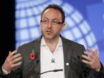 FILE - In this Nov. 1, 2011 file photo, Jimmy Wales, founder of Wikipedia speaks during the opening session at the London Cyberspace Conference in London. Wikipedia will black out the English ...