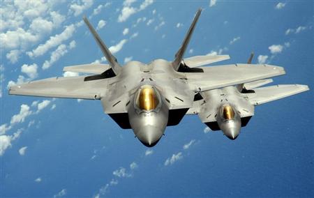 Two U.S. Air Force F-22 Raptor stealth jet fighters fly near Andersen Air Force Base in this handout photo dated August 4, 2010. REUTERS/U.S. Air Force/Master Sgt. Kevin J. Gruenwald/Handout