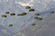 US paratroopers are dropped by a US airforce C17 (not pictured) during a training exercise over Maniago near Aviano air base, in 2011. The US military Tuesday vehemently denied a media report that special forces had been parachuted into North Korea on intelligence-gathering missions, saying a source had been misquoted. (AFP Photo/Giuseppe Cacace)