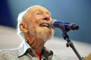File-This Sept. 21, 2013, file photo shows Pete Seeger performing on stage during the Farm Aid 2013 concert at Saratoga Performing Arts Center in Saratoga Springs, N.Y. The American troubadour, folk singer and activist Seeger died Monday Jan. 27, 2014, at age 94. (AP Photo/Hans Pennink, File)