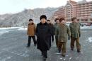 This undated picture released by North Korea's official Korean Central News Agency (KCNA) on December 31, 2013 shows North Korean leader Kim Jong-Un (C) inspecting a ski resort on Masik Pass to be completed in Kangwon province