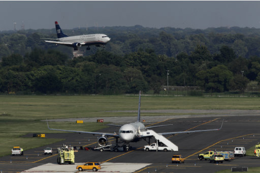 Aug. 5, 2011, in Philadelphia. Passengers aboard a US Airways flight ...
