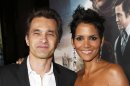 FILE - This Oct. 24, 2012 file photo shows actors Olivier Martinez, left, and Halle Berry at the Los Angeles premiere of Berry's film, "Cloud Atlas," in the Hollywood section of Los Angeles. Berry has married Martinez at a weekend ceremony in a church near a chateau in France's Burgundy region. The owner of the Chateau de Vallery, where the couple stayed with their 60 guests, said on Sunday July 14, 2013, that the betrothal a day earlier ended with a dinner and fireworks display. (Photo by Todd Williamson/Invision/AP, File)